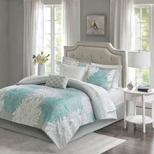 Transform your bedroom into a comfortably casual retreat with the Madison Park Essentials Maible Complete Comforter and Cotton Sheet Set. A beautiful printed floral design