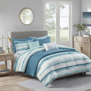 Create a relaxing and tranquil atmosphere in your bedroom with Madison Park’s Marina 8 Piece Printed Seersucker Comforter and Quilt Set Collection. The textured seersucker comforter features a watercolor stripe print in storm blue