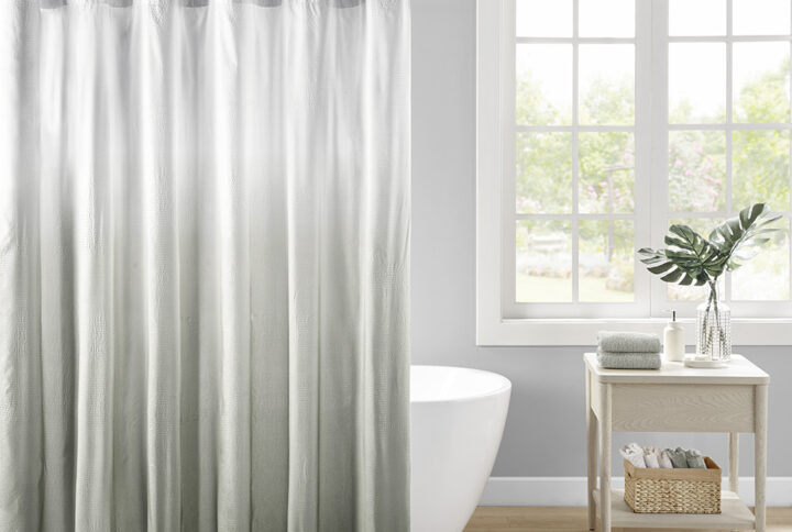 Add a refreshing touch to your bathroom decor with our Madison Park Ara Ombre Printed Seersucker Shower Curtain. This shower curtain features a grey ombre print on an embossed seersucker fabric