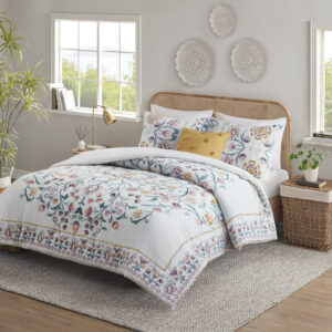 This shabby chic comforter set features a large floral print design in the center while blossoms line the edges of the comforter creating an enchanting border. Included with this set is one square decorative pillow with tufted pom poms for a touch of whimsical delight. Colors found in this bed set include various shades of teal