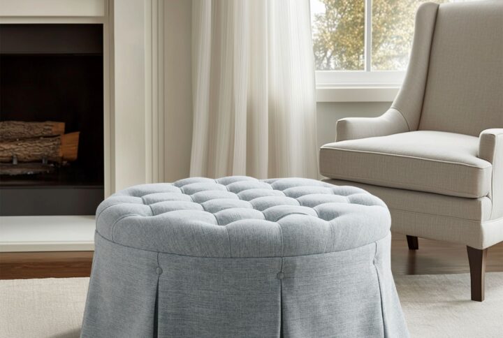 Complement your living room decor with the Martha Stewart Terri Button Tufted 32" Round Ottoman. This round ottoman features a button tufted top with an elegantly pleated skirt to create a stunning transitional look. Perfect for accenting your living room