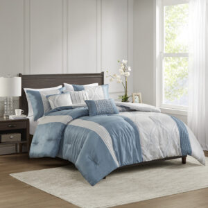 This traditional jacquard comforter set features an elegant ogee design pieced with solid stripes in a vertical layout for an opulent bedroom update. The three throw pillows featuring pintucks