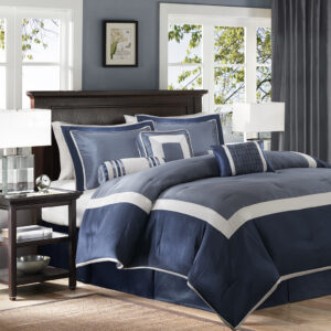 The Genevieve bedding collection creates a neutral feel to your space with a shades of blue. This set is made from 100% polyester polyoni creating a sheen to the navy