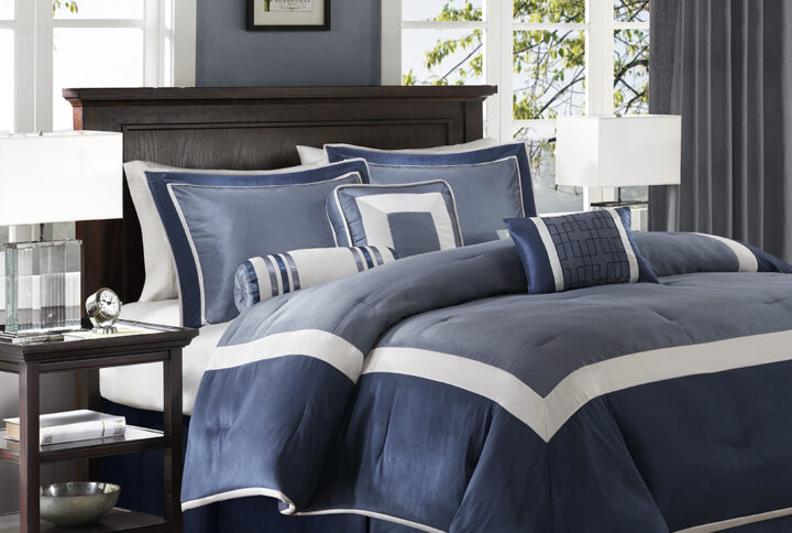 The Genevieve bedding collection creates a neutral feel to your space with a shades of blue. This set is made from 100% polyester polyoni creating a sheen to the navy