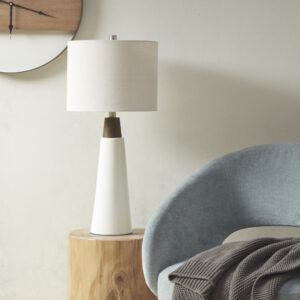 The INK+IVY Tristan Triangular Ceramic and Wood Table Lamp provides a refined addition to your home decor. Showcasing a two-tone conical stand