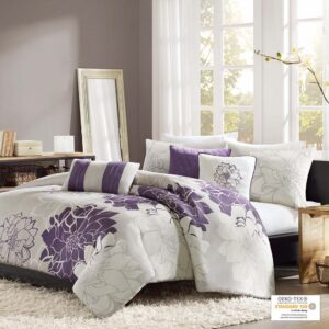 The Madison Park Lola 6 Piece Printed Duvet Cover Set transforms your bedroom into a beautiful and graceful space. A gorgeous floral print in a soft white and purple hue pops against the solid taupe grey ground cotton duvet cover and shams for a stunning transitional look. Three decorative pillows with embroidered details and fabric manipulation add texture and dimension to the bed