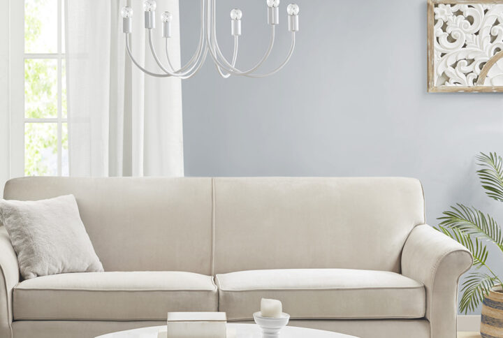 The 510 Design Ellie 6-Light Metal Chandelier brings a simple and refined update to your kitchen or dining room. This 6 bulb chandelier features a contemporary gloss white finish on the all-metal frame to create a chic transitional design. The 6 curved rods each support an unshaded light bulb