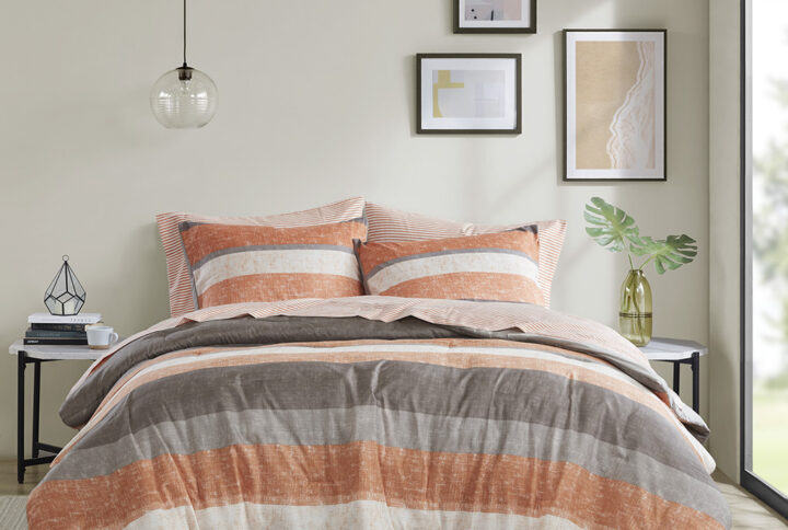 Revamp your bedroom style with the Madison Park Essentials Jaxon bed in a bag. This modern comforter set features a stripe pattern in alternating coral