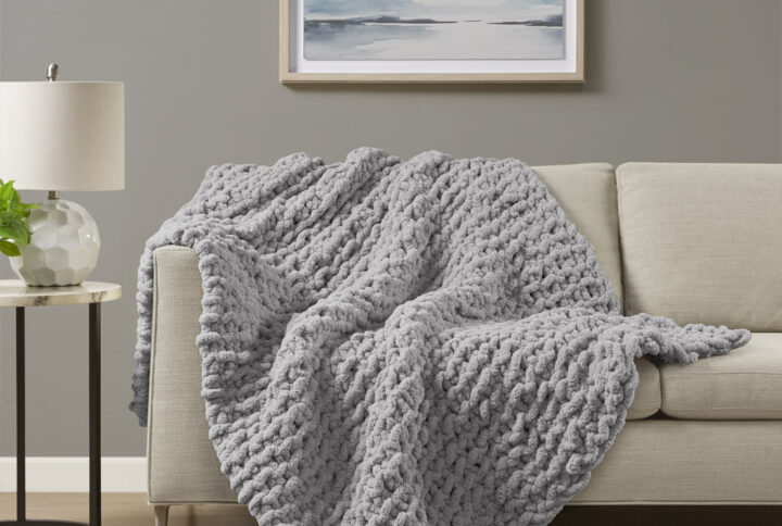 Indulge in pure comfort by wrapping yourself in the Madison Park Chenille Chunky Knit Throw. This chunky knit throw is handmade from luxurious chenille yarn to create a soft and cozy feel that's perfect to snuggle up in. The chunky knit throw is also OEKO-TEX certified