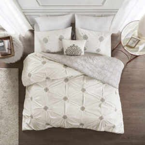 Style your bedroom with the shabby chic allure of the Madison Park Malia 4 Piece Embroidered Cotton Reversible Duvet Cover Set. The face of the reversible duvet cover features tufted grey embroidery on an ivory base