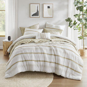 The Madison Park Carolina 7 Piece Stripe Comforter/Quilt Set is made of 100% polyester microfiber. This taupe and white bedding set features a variety of color-blocked stripe prints and exquisite trim