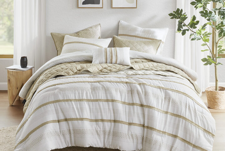 The Madison Park Carolina 7 Piece Stripe Comforter/Quilt Set is made of 100% polyester microfiber. This taupe and white bedding set features a variety of color-blocked stripe prints and exquisite trim