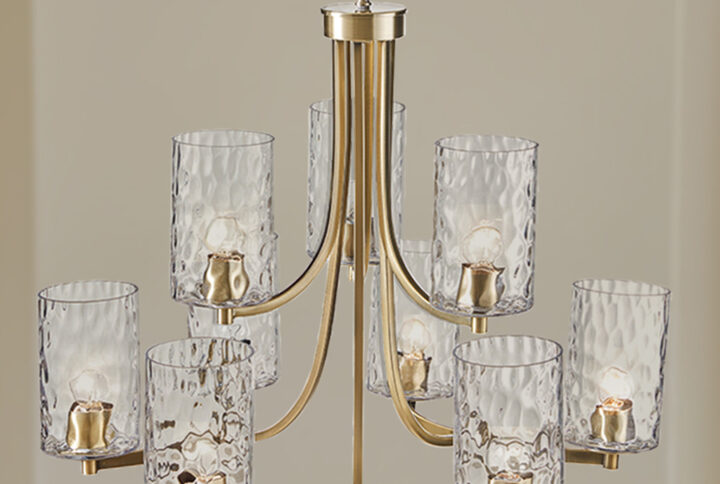 Introducing the Opulentia 9 Light Chandelier by Hampton Hill. This transitional style chandelier adds a modern touch with its sleek antique brass finish