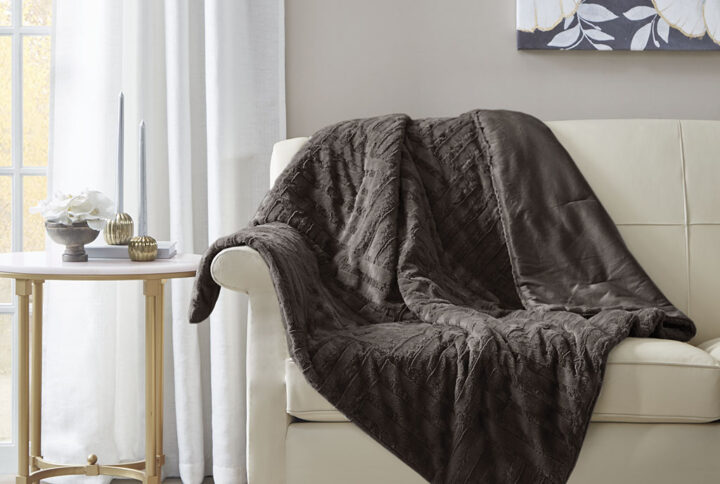 Keep yourself warm and cozy with the Arctic plush throw. The ultra plush fabric is incredibly soft and features a checkboard design for added texture and dimension. This throw is machine washable for easy care and is also OEKO-TEX certified