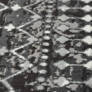 cut area rug features a charcoal and grey globally inspired print creating a rich and beautiful