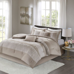 The Madison Park Ava 7 Piece Chenille Jacquard Comforter Set offers a luxurious update to your bedroom décor. The luxurious taupe comforter and shams flaunt a pieced design with stripes of textured chenille jacquard that creates a stunning three dimensional effect. The 2 square decorative pillows and one oblong pillow are stuffed with hypoallergenic filling and feature embroidery and pleating details that provide elegant touches for the top of the bed. A solid taupe bed skirt completes the comforter set