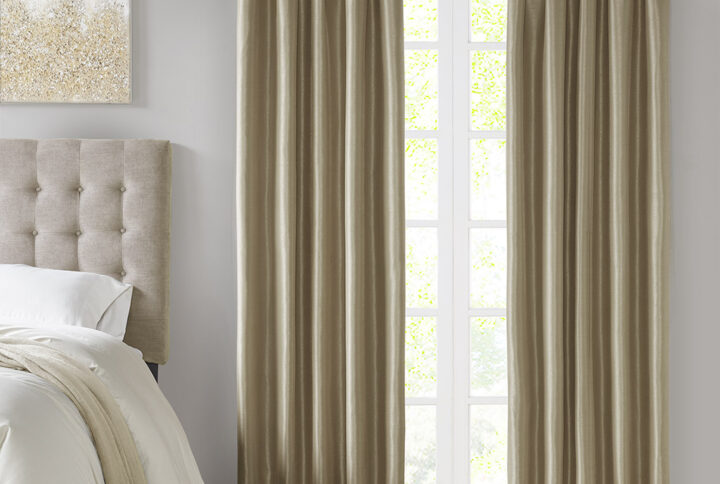 Energy efficiency meets a sophisticated style with the Madison Park Emilia Twist Tab Total Blackout Window Curtain. This window curtain panel showcases a DIY twist tab top finish that allows you to create an elegant display in your living room or bedroom space. The faux silk sheen base fabric features a 3 pass foamback liner on the reverse to block out all outside light