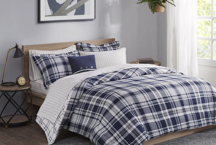 Restyle your bedroom with the Madison Park Essentials Patrick Reversible Comforter Set with Sheet Set. The reversible comforter and shams (1 in Twin Sizes) feature a navy plaid print on the face and a white plaid print on the reverse