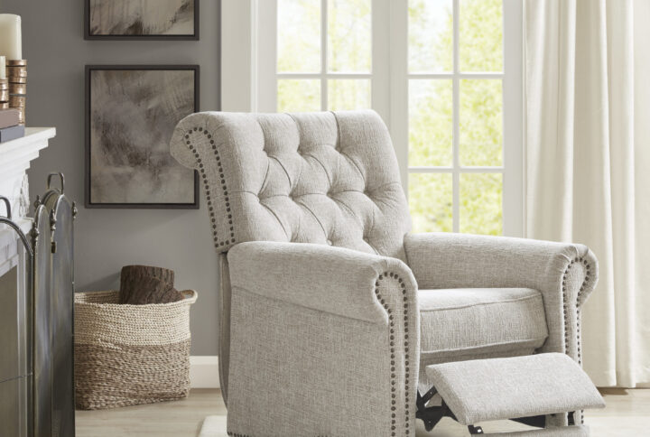 Update your living space with the elegant transitional style of the Madison Park Aidan Push Back Recliner. Rounded arms and a high rounded back give this recliner chair a simple