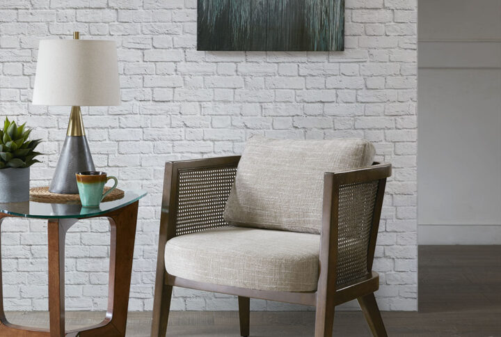 Make a statement in your living space with the unique style of the INK+IVY Sonia Accent Chair. Featuring authentic natural cane inset on the track arms and back