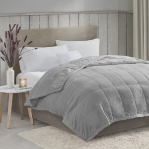 Wrap yourself in the soft plush cozy comfort with this reversible down alternative blanket. Treated with HeiQ smart temperature to help maintain a balanced temperature by retaining body heat when you're cold or wicking away moisture to cool you off when you're hot. This blanket features a soft plush face that reverses to a solid microfiber