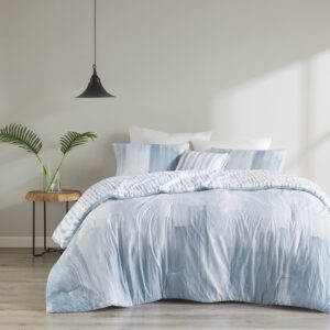 The N Natori Brush Stroke 4 Piece Reversible Seersucker Comforter Set elevates your bedroom with its simple and elegant lounge style. This reversible comforter flaunts a soft blue