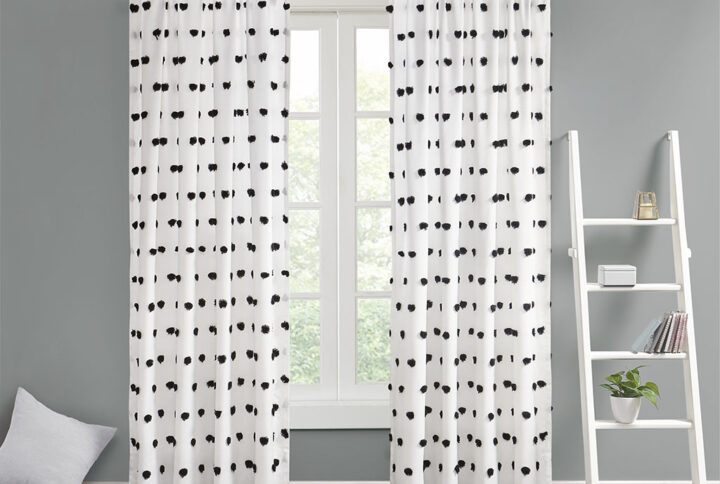 Add a unique and fun style to your bedroom with the Intelligent Design Sophie Pom Pom Embellished Window Panel. This window panel features an all-over clipped soft pompom detailing