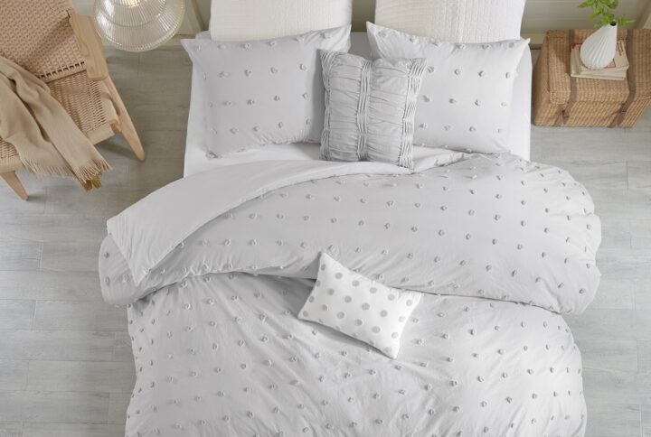 The Urban Habitat Brooklyn Cotton Jacquard Duvet Cover Set features small tufted chenille dots that create a fresh shabby chic look. This duvet cover set brings a soft and charming update to your bedroom