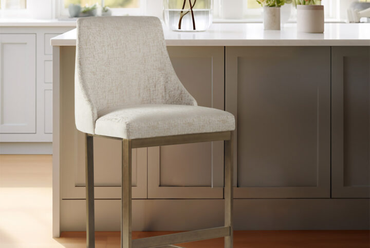 Bryce counter height stool from Madison Park combines modernity with traditional elegance. Its curved arms and rounded back exude style