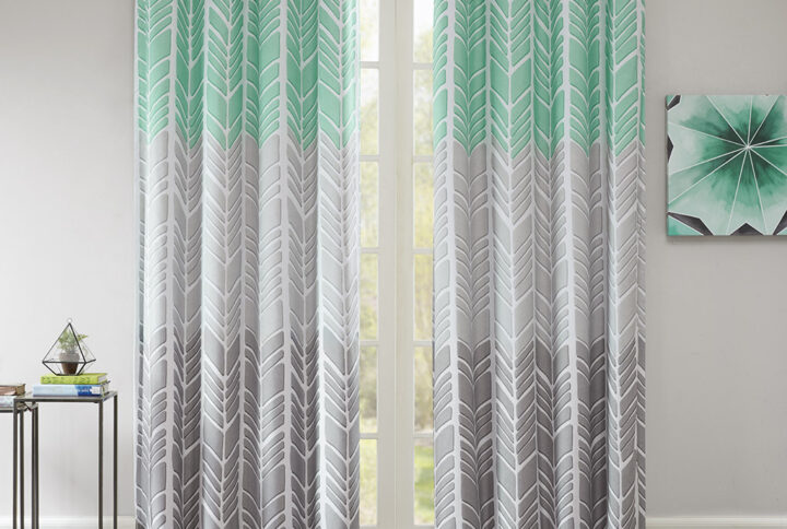 Create a color blocked look in your room with our Intelligent Design Adel Total Blackout Window panel. This geometric chevron design uses light grey