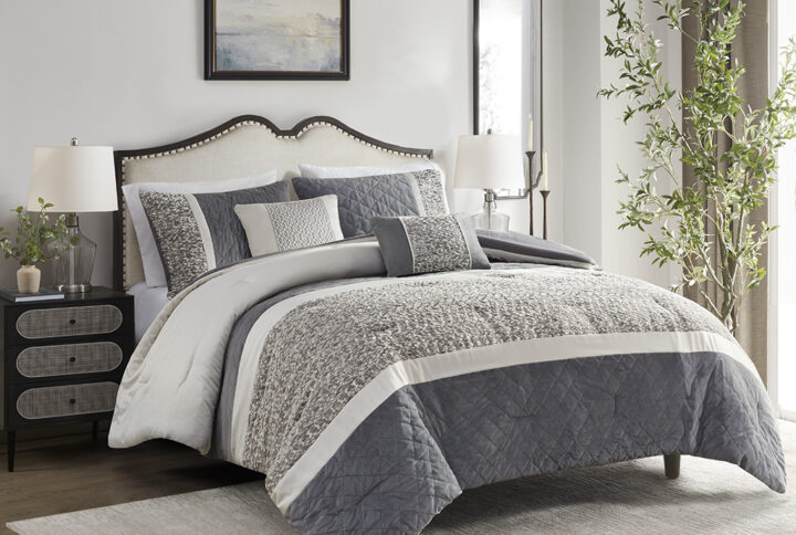 This transitional style comforter set features a boucle textured jacquard fabric pieced with quilted mink and charmeuse that is the perfect modern update to any traditional bedroom. Also included are two decorative pillows featuring either the matching boucle texture design or embroidery details to add a touch of elegance to the overall set. The main colors present is a pewter grey which balances well with the creamy birch tone. Made with 100% hypoallergenic polyester filling