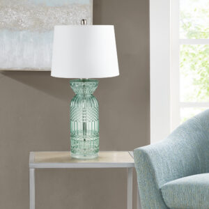 Elevate your decor with this Luxuria table lamp from 510 Design. Featuring an aqua blue textured glass body on a clear acrylic base