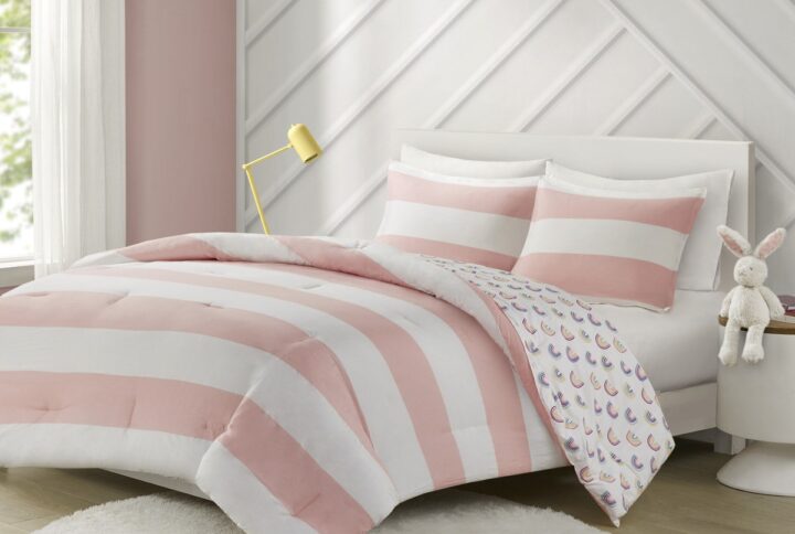 Add a bright and playful update to your kid's bedroom with the Urban Habitat Kids Sammie Cotton Cabana Stripe Reversible Comforter Set. This soft cotton comforter and 2 shams (1 in Twin) features a classic pink and white cabana stripe with a colorful rainbow print on the reverse