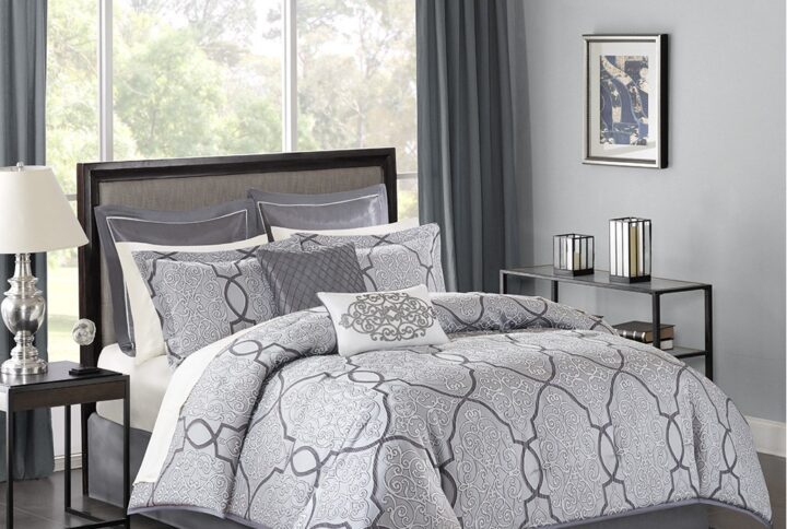 The Madison Park Lavine 12 Piece Bedding Collection gives your bedroom a rich and luxurious makeover. The comforter features a metal grey jacquard woven fabric with a 3D effect created by a damask design in light and dark grey. The two pillow shams match the comforter design to enhance the luxury style. Two decorative pillows with embroidery and fabric manipulation details coordinate with the two euro shams for a stunning bedroom look. The set also comes with a complete ivory 100% cotton sheet set that adds a cozy touch to the bedding set. The items in the set may arrive in a rolled or compressed form