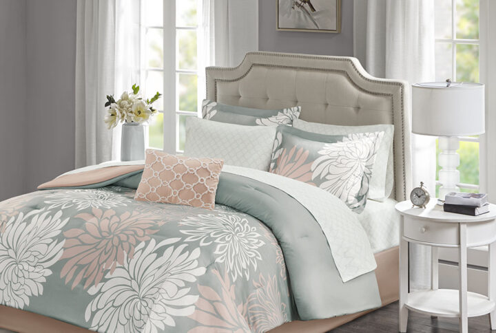 Transform your bedroom into a comfortably casual retreat with the Madison Park Essentials Maible Complete Comforter and Cotton Sheet Set. A beautiful printed floral design