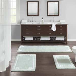 The Madison Park Evan Cotton Tufted Bath Rug provides the perfect balance of comfort and style to update your bathroom. This tufted bath rug features a contrasting white border on a soft colored ground creating a clean hotel look