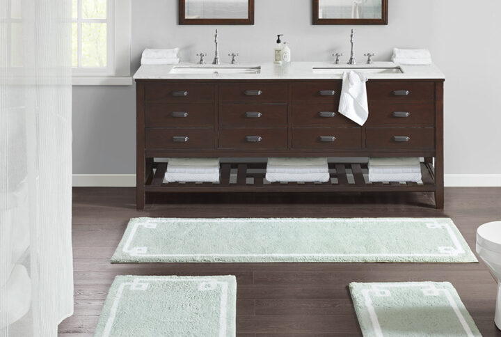 The Madison Park Evan Cotton Tufted Bath Rug provides the perfect balance of comfort and style to update your bathroom. This tufted bath rug features a contrasting white border on a soft colored ground creating a clean hotel look