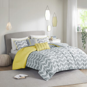 The Intelligent Design Nadia Comforter Set updates any bedroom into fun and inviting space. This stylish comforter features a grey and white chevron print broken up by white vertical stripes and a solid yellow at the top that pops! The 2 matching shams (1 in Twin/TwinXL) with a yellow flange pairs perfectly with the delightful chevron pattern