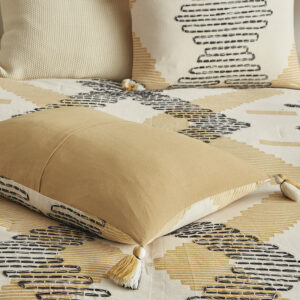 for a modern take on a southwestern design. Coordinating tassels at the end corners of the comforter add an elegant touch