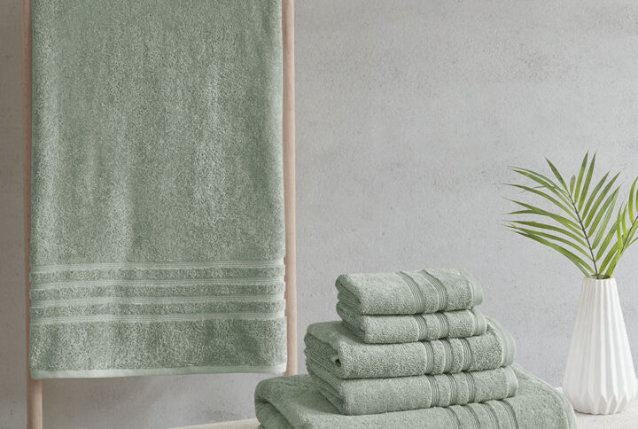 Complete your bathroom decor with our Clean Spaces Nurture Sustainable Antimicrobial 6PC Towel Set. This eco-friendly solid green towel set is made from regenerated cotton and recycled polyester fibers safeguarding our resources for a better carbon footprint