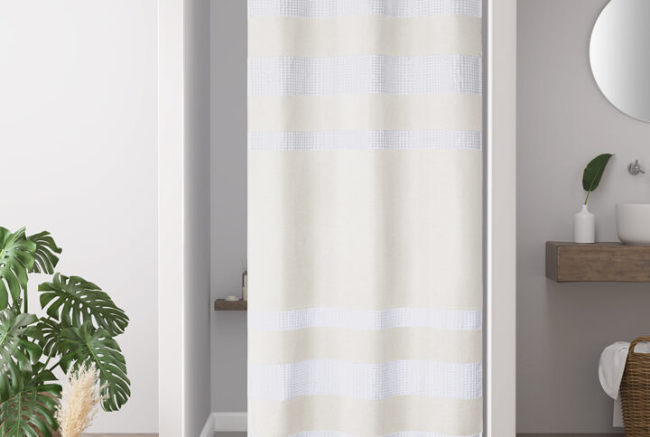 Update your space with the Madison Park Spa Waffle Shower Curtain with 3M Treatment. Featuring a fresh and updated stripe design