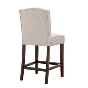 for a chic transitional look. The button-tufted accents on the back add an elegant touch to the design. A espresso wood finish on the solid wood legs provides a bold contrast to the upholstery