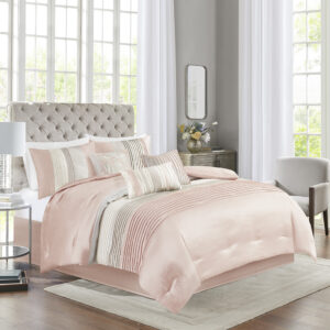 The Madison Park Amherst 7 Piece Comforter Set offers a beautiful update to your bedroom décor. The polyester faux silk comforter and shams features a pieced and pintucked design in blush