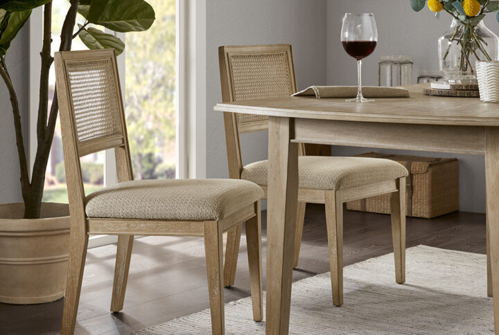 The INK+IVY Kelly Dining Side Chair Set offers a charming urban farmhouse appeal to your dining decor. Featuring a cane inset back and an upholstered seat