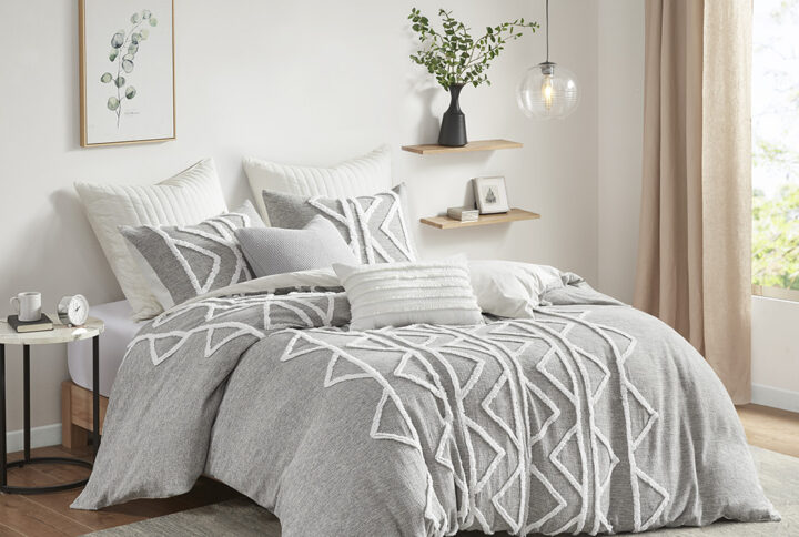 The INK+IVY Hayes 3 Piece Cotton Chambray Duvet Cover Set with Chenille brings a perfect blend modern and boho styles to your bedroom. This cotton duvet cover features chenille taping and trims