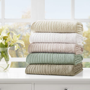 Tuscany is the perfect quilted throw for a new solid look. The decorative stitch pattern pairs easily with your existing decor and will sure to add a new decorative element with the beautiful scalloped edges. This quilted throw is filled with cotton filling and features a polyester microfiber fabrication on the face and the reverse. Its prewashed finish gives a worn in appearance to this decorative throw.