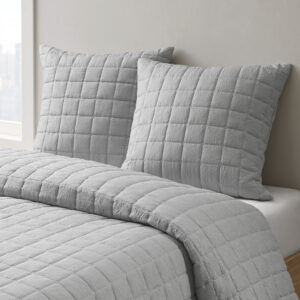 The Cocoon Quilt Top Euro Sham by N Natori adds a simple and elegant touch to your bedroom décor. This solid Euro sham flaunts super soft crushed microfiber with a lofty over-quilted bot pattern to create a rich and textural modern look. A hidden zipper closure provides a clean