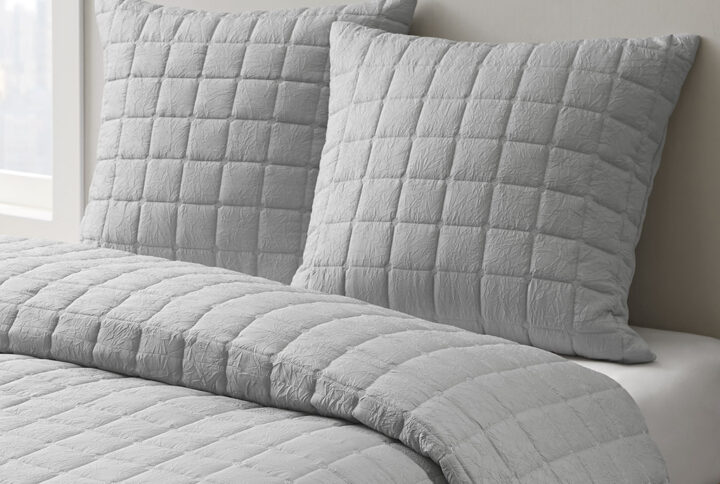 The Cocoon Quilt Top Euro Sham by N Natori adds a simple and elegant touch to your bedroom décor. This solid Euro sham flaunts super soft crushed microfiber with a lofty over-quilted bot pattern to create a rich and textural modern look. A hidden zipper closure provides a clean