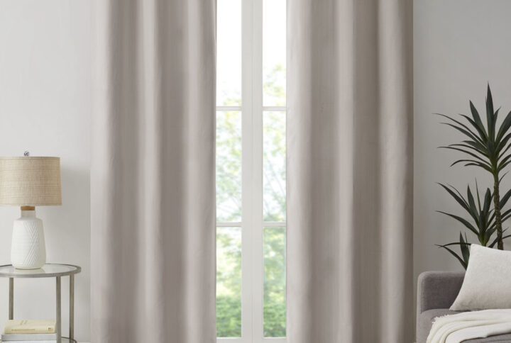 Create a stylish and comfortable space with the Madison Park Galen Basketweave Room Darkening Window Panel Pair. These room darkening window curtains are made from a basket weave texture base fabric that creates a natural look and feel. A thermal foambacking on the reverse provides energy efficiency and serves as an effective barrier to soften exterior light and noise. When closed