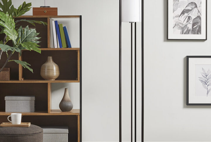 The Martha Stewart Charlton Metal Floor Lamp with Glass Cylinder Shade provides an easy way to elevate and illuminate your room. Featuring a sleek